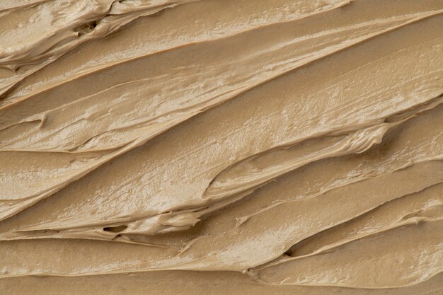 Brown frosting texture background close-up