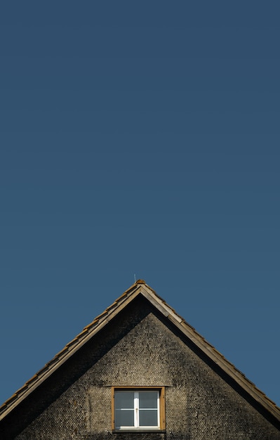 Brown and gray house under blue sky during daytime