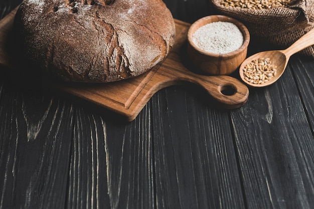 Brown loaf of bread on board