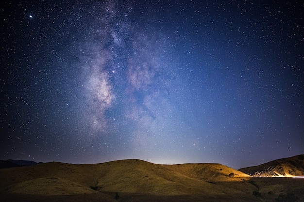 Free Photo brown mountain under blue sky during night time