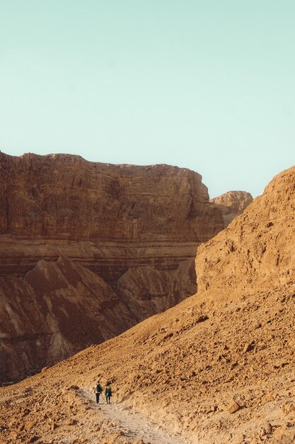 Brown rocky mountain under blue sky during daytime