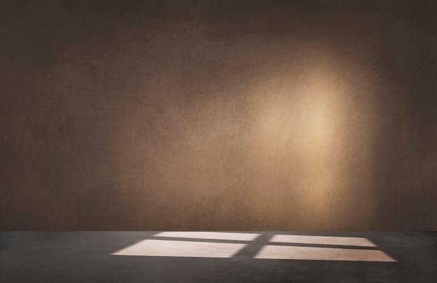 Brown wall in an empty room with concrete floor