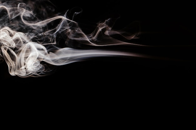 Brown wavy smoke on black background