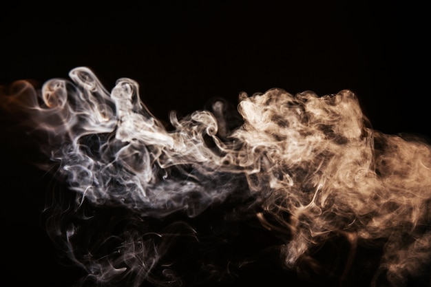 Brown wavy smoke on black background