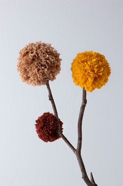 Brown and yellow pom poms arrangement