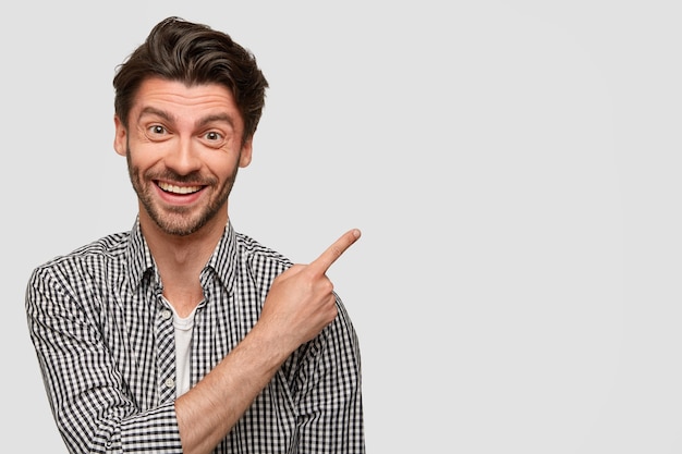 Brunet man wearing checkered shirt