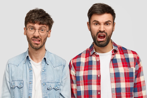 Free photo brunet men wearing shirts and posing