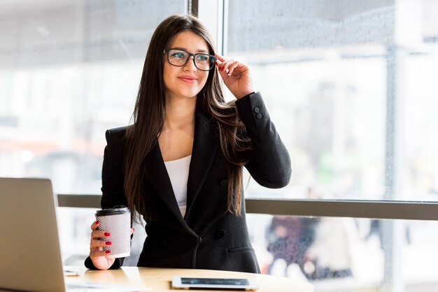 Brunette businesswoman with coffee