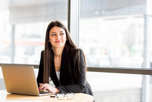 Brunette businesswoman with laptop