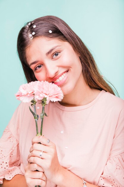 Brunette girl posing with flowers