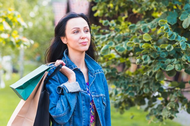 Brunette lady with shopping bags