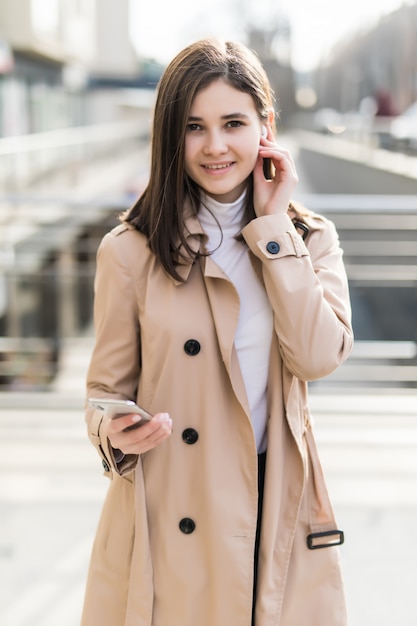 Brunette model put her wireless headphones on during videocall