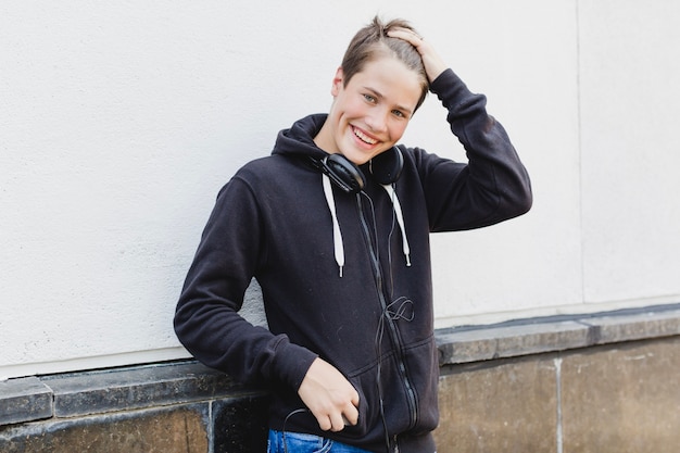 Free photo brunette smiling man standing outside