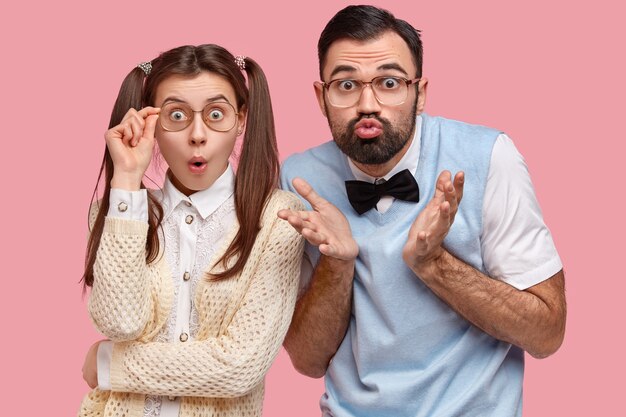 Brunette woman with pigtails and man wearing bowtie and vest