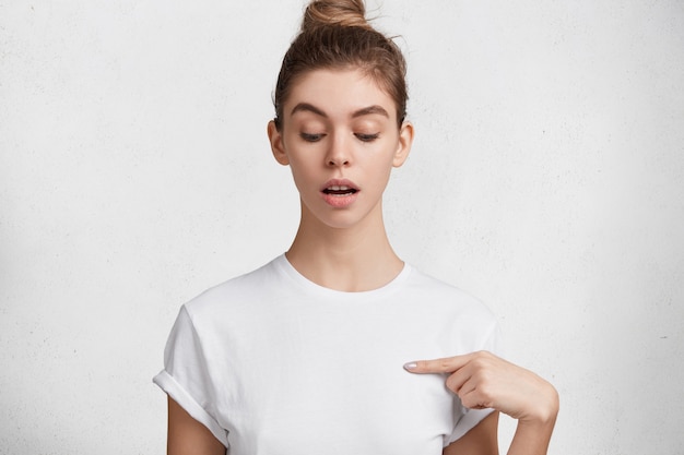 Brunette young woman in white T-shirt