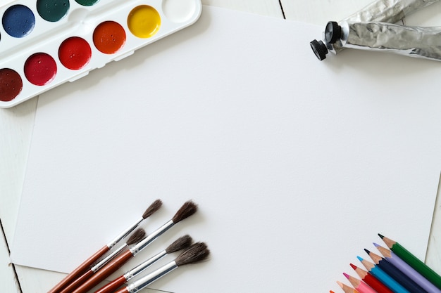 Free photo brushes, pencils and watercolors, top view background