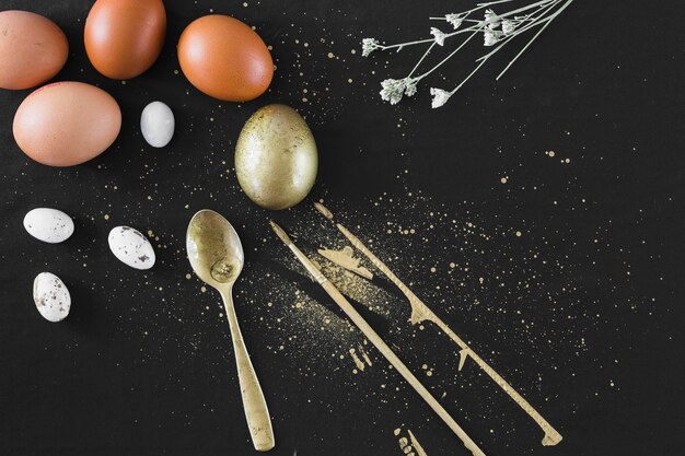 Brushes and spoon near assorted eggs