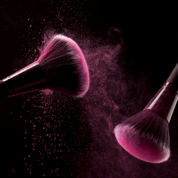 Brushes with particles of pink powder