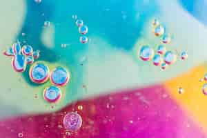 Free photo bubbles over the blue and pink textured background