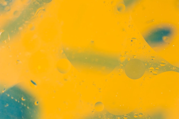 Free photo bubbles pattern over the painted yellow background