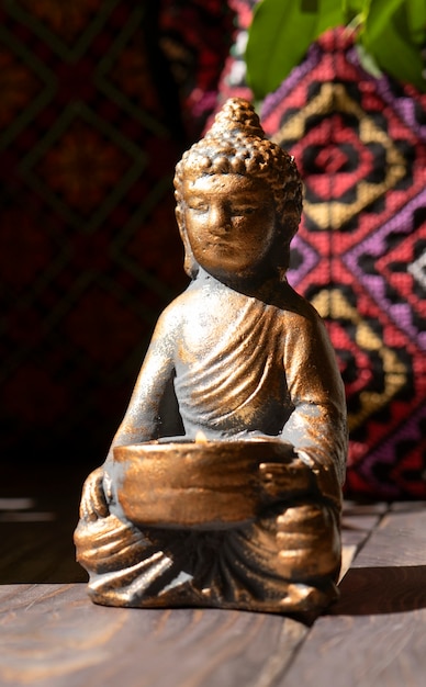 Free photo buddha figurine still life