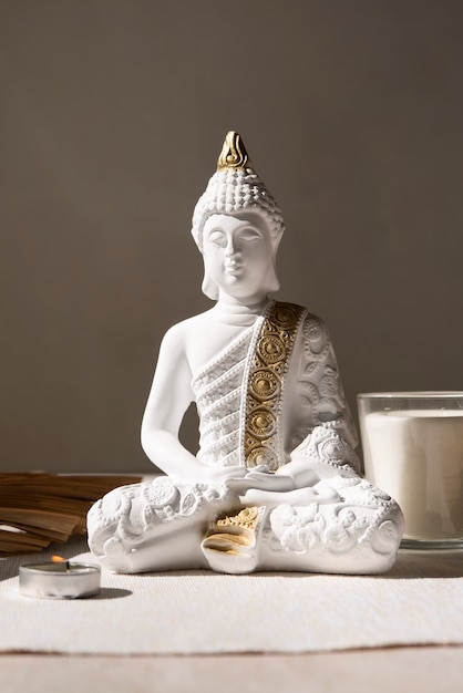 Free photo buddha figurine still life