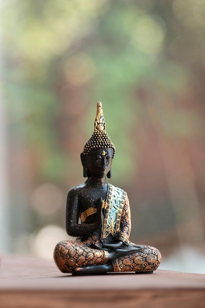 Free photo buddha figurine still life