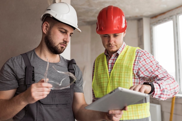 Builder men wearing helmets