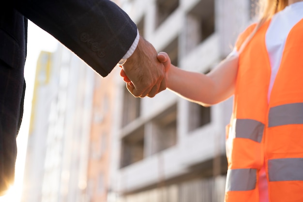 Free Photo building and construction worker on the site with architect