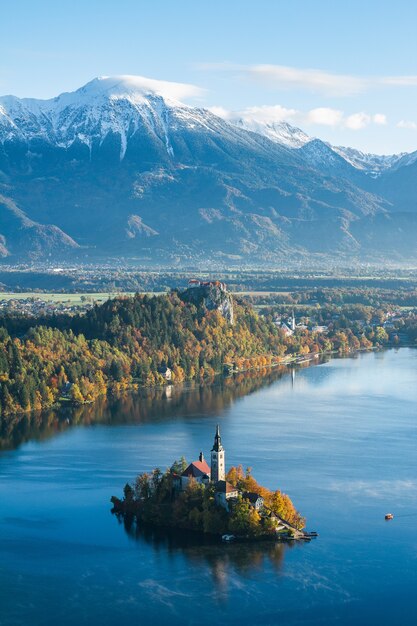 building on a small island in Bled, Slovenia surrounded by high mountains