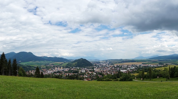 Free photo buildings and a green lawn in ruzomberok, slovakia