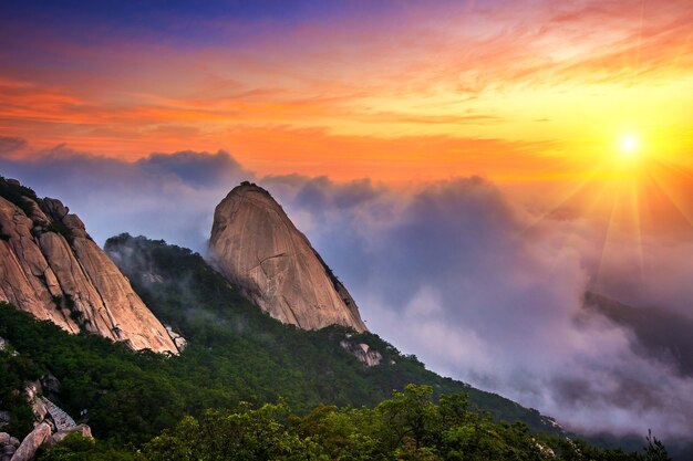 Bukhansan mountains is covered by morning fog and sunrise in Seoul,Korea