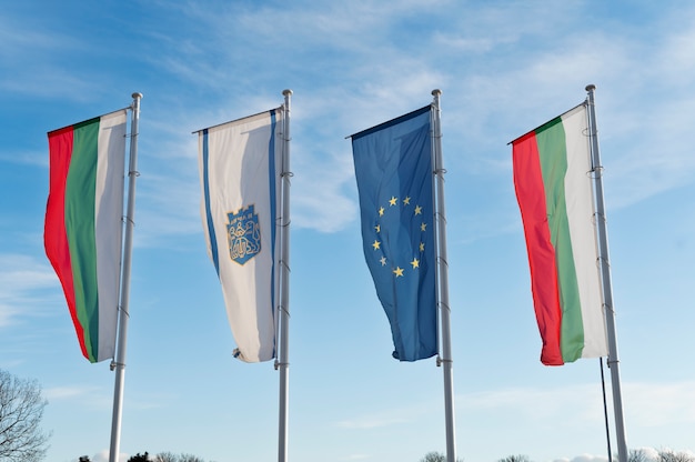 Free photo bulgarian flag outdoors next to other flags