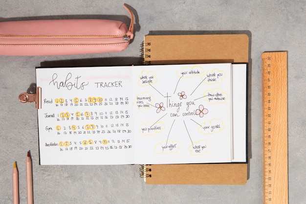 Free photo bullet journal and desk supplies above view