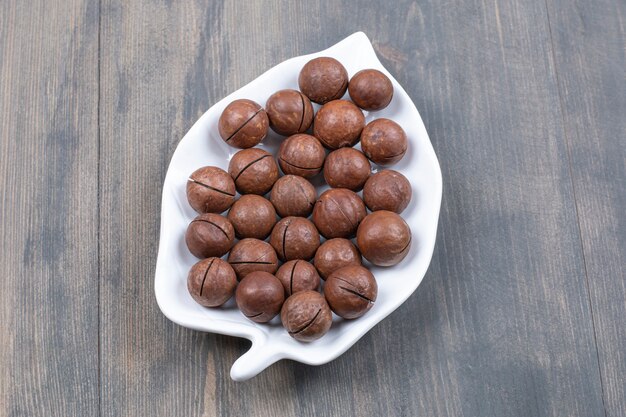 Bunch of chocolate balls on white plate