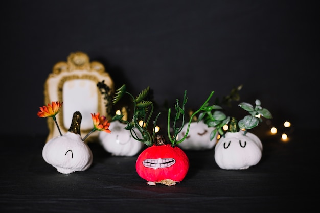 Bunch of funny decorated garlic