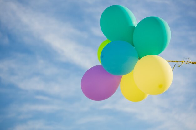 Bunch of pastel color balloons floating in the air