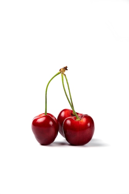 Free photo a bunch of red cherries on white background