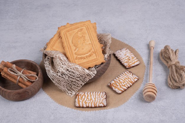 Bunch of various biscuits and cinnamon sticks on gray background. High quality photo