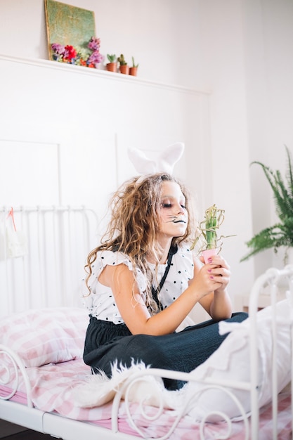 Free Photo bunny girl with plant