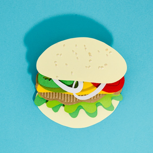 Free Photo burger replica on a blue background