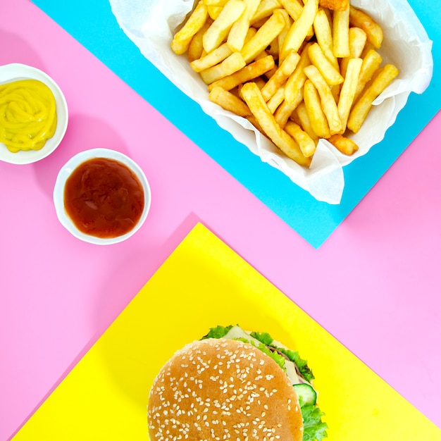 Burger with french fries with ketchup and mustard