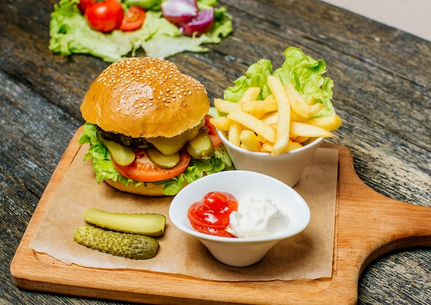 Burger with lots of pickle and fries