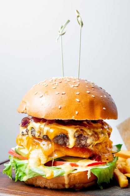 burger with meat cutlet tomatoes lettuce and cheese