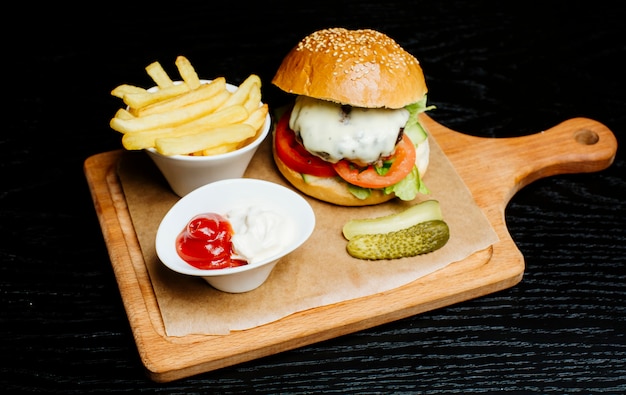 Burger with side fries, pickles and fry sauce