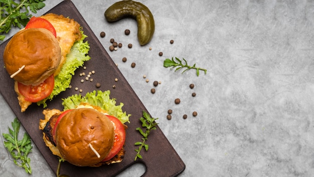 Free Photo burgers on grey table with copy space