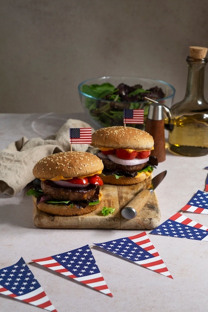 Free Photo burgers with usa flag on wooden board arrangement