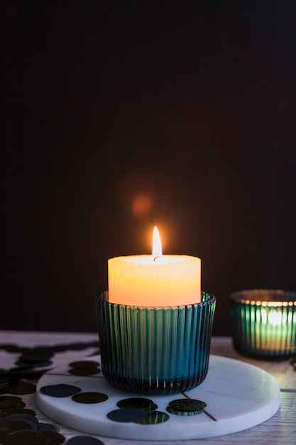 Free photo burning candle in candlestick