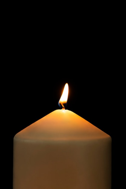 Free Photo burning candle light realistic flame, black background high resolution image