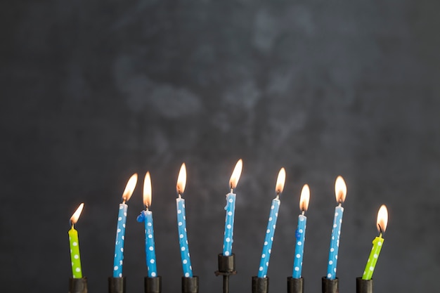 Burning candles of menorah